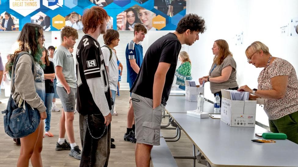 Students queue to get their results at Llanishen High School on August 20, 2026 in Cardiff, Wales.
