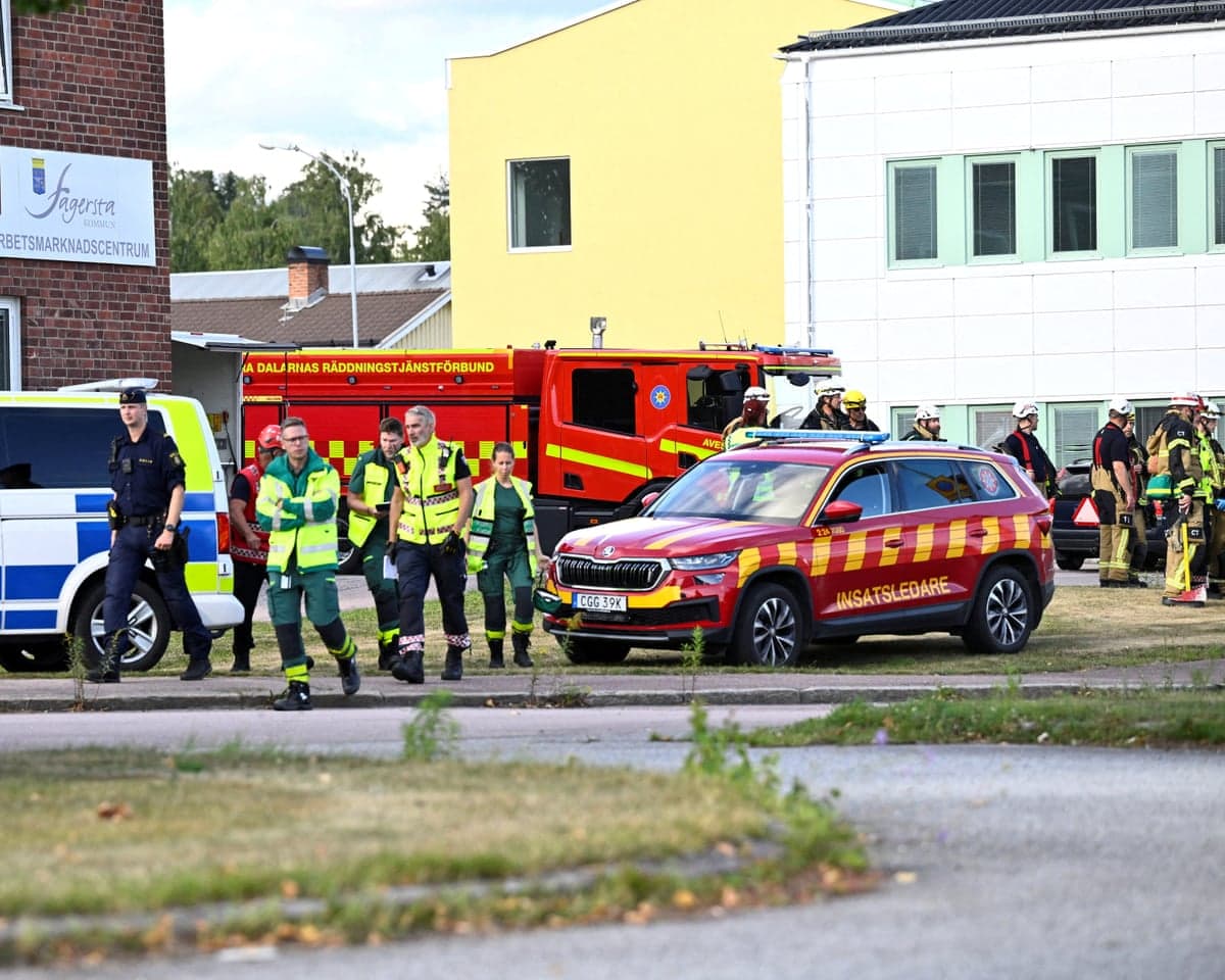 Police and emergency personnel outside the Brinell school in Fagersta, Sweden, after a 17-year-old girl was killed and several people were injured in a sword attack.