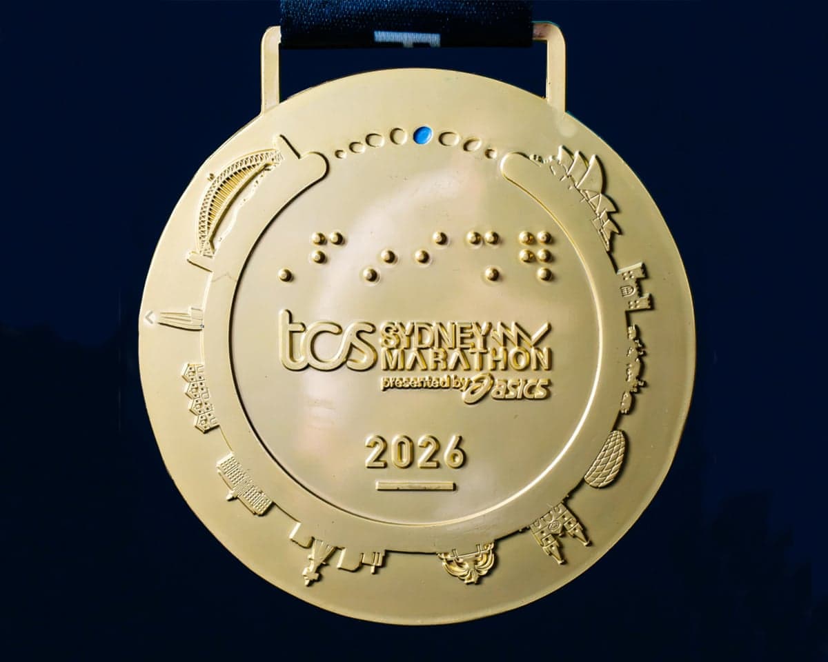 The Sydney Marathon medal featuring various landmarks around the edge