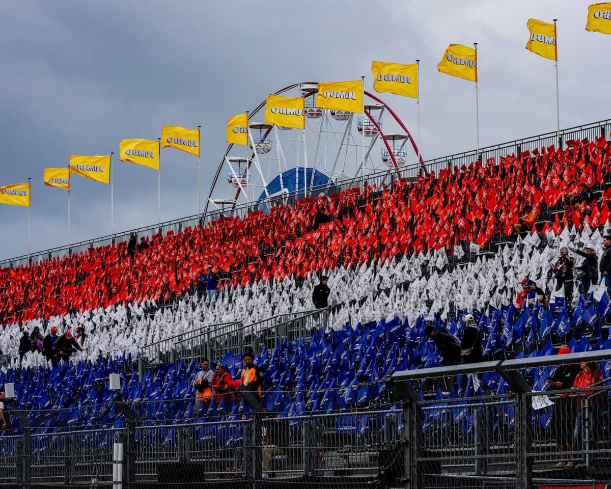 The grandstands at Zandvoort are filled with red, white and blue flags