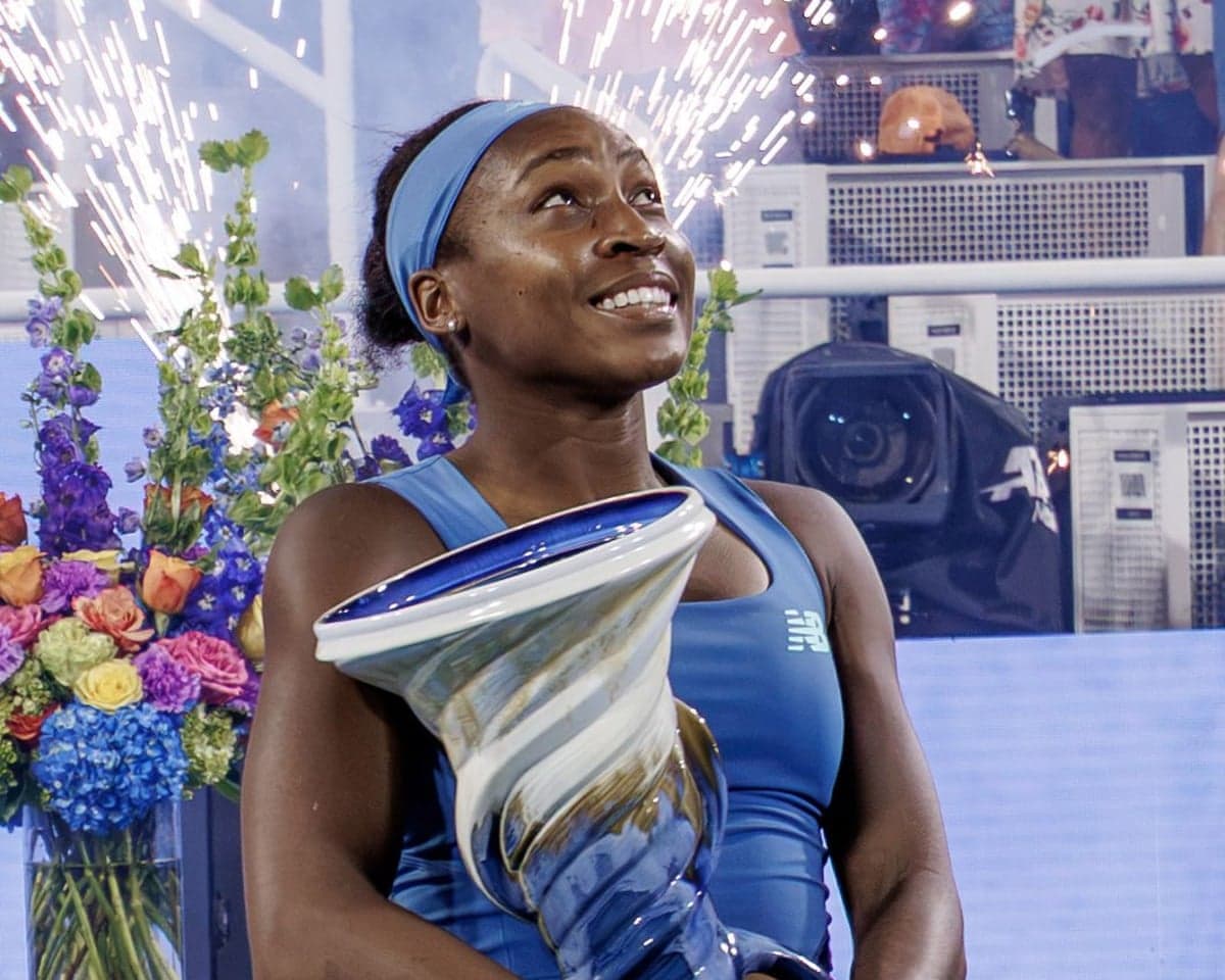 Coco Gauff watches the fireworks after receiving the Rookwood trophy for winning the women's title at the Cincinnati Open.