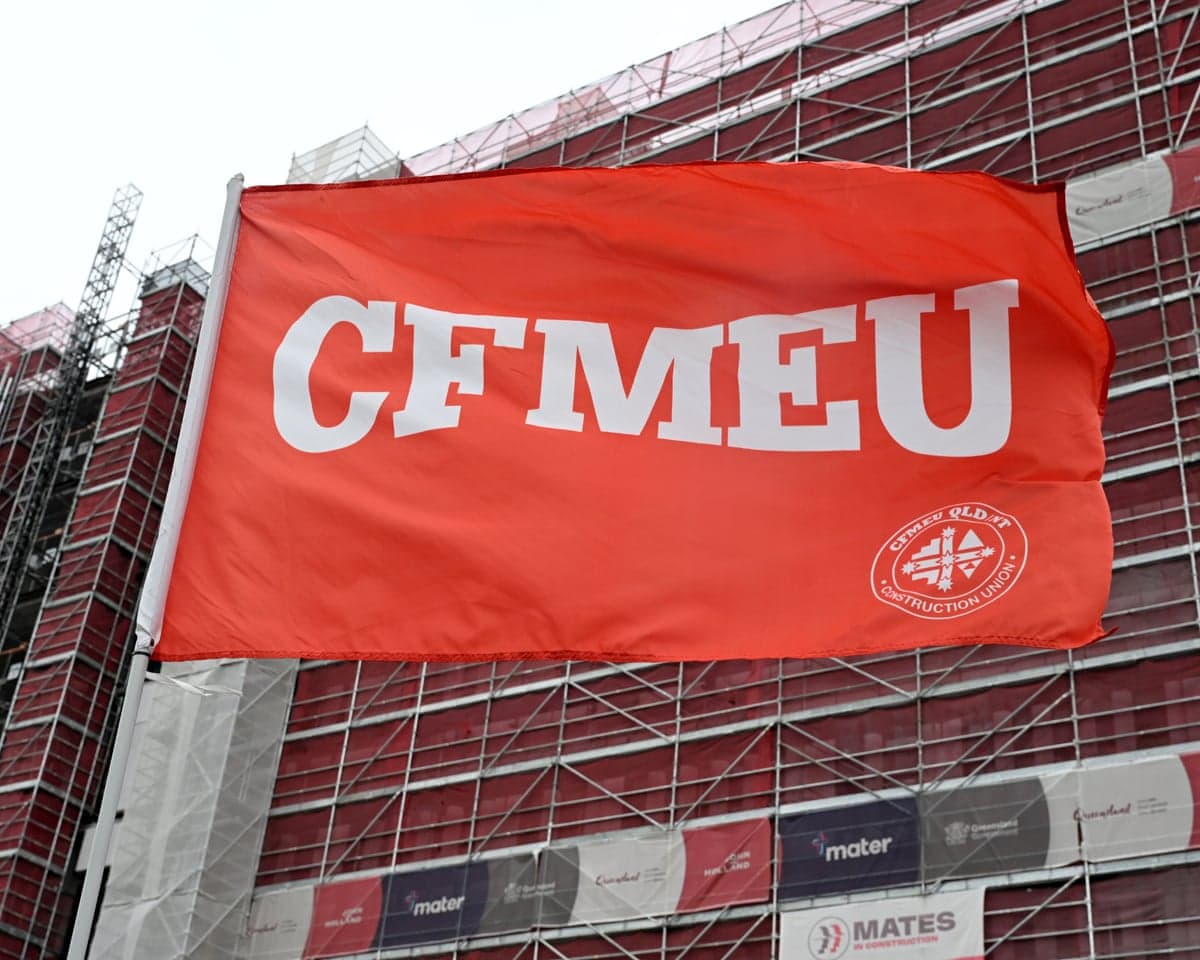 A bright orange CFMEU flag flies near the Mater Hospital Springfield construction site