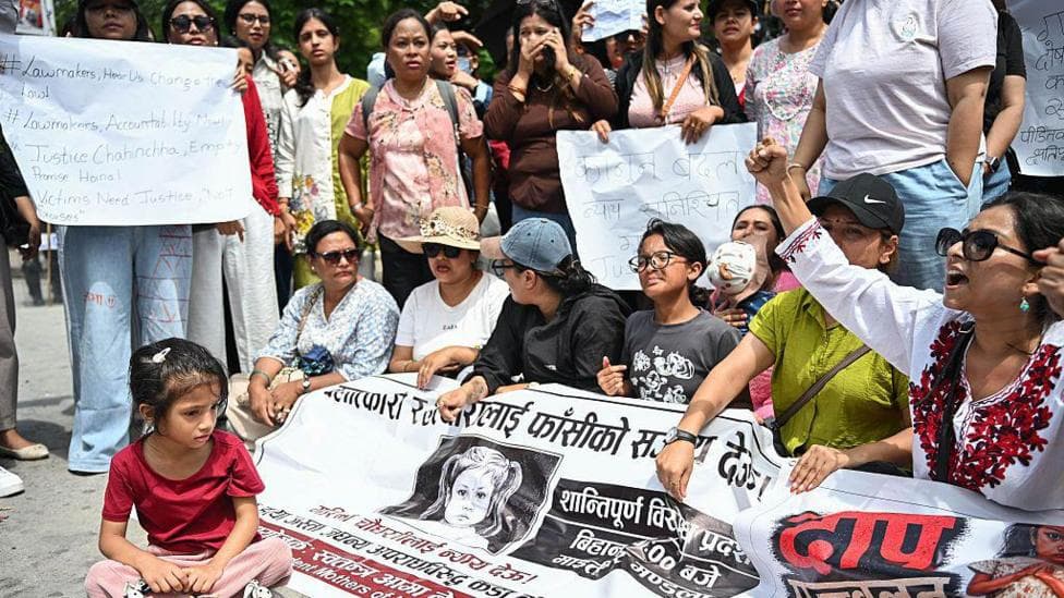 A child participates in a protest in Kathmandu, Nepal, on 22 August 2026, demanding justice for a three-year-old girl in Bara district, who was raped and killed.