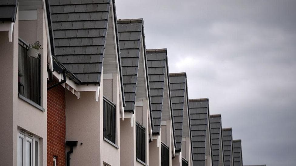 The tops of new build houses standing in a row