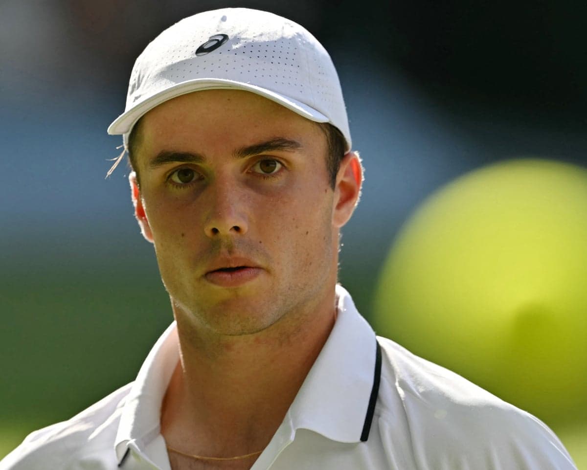 Arthur Fery looks at the ball as he plays against Grigor Dimitrov during their last-16 match at Wimbledon