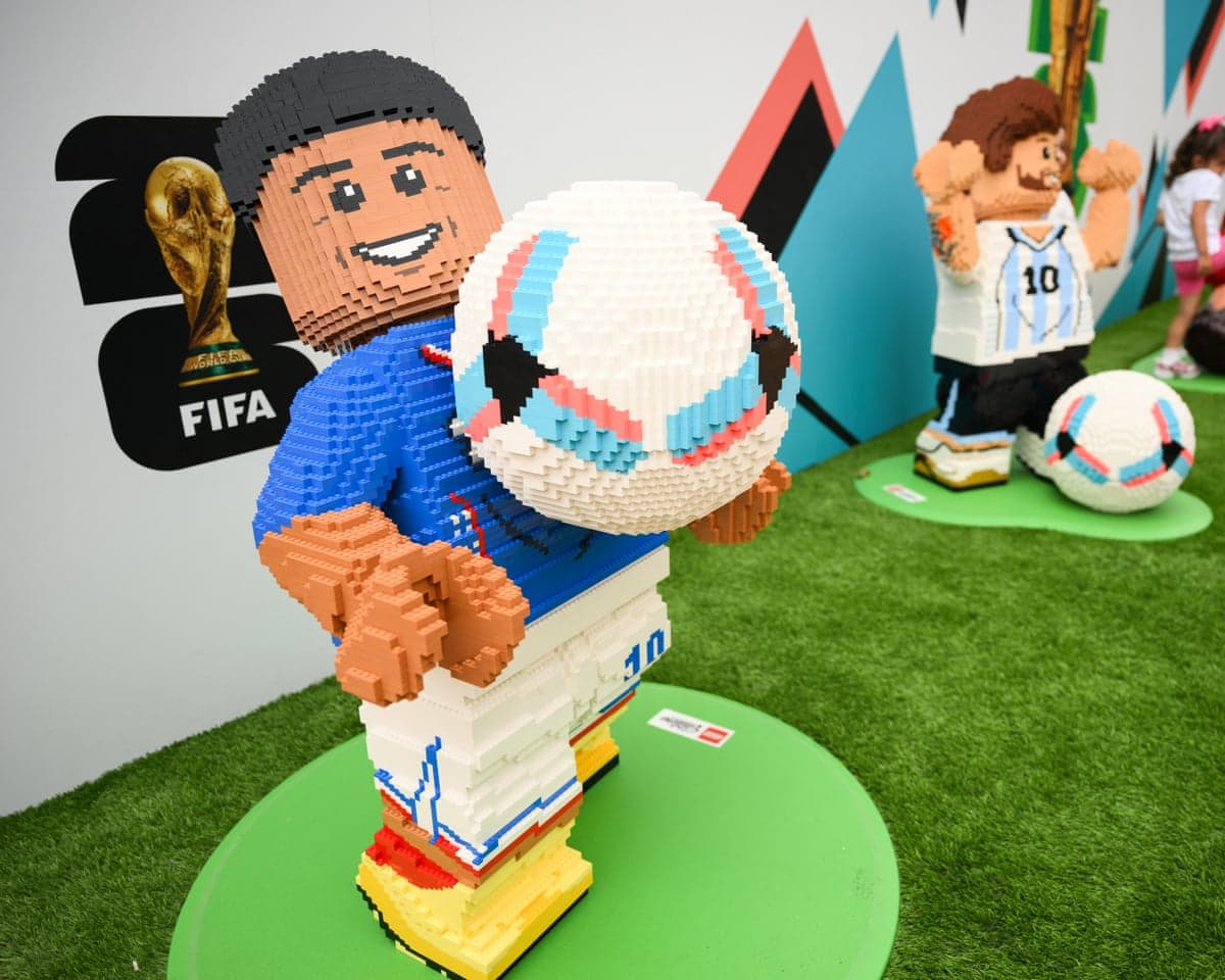 Children play with Lego World Cup figures