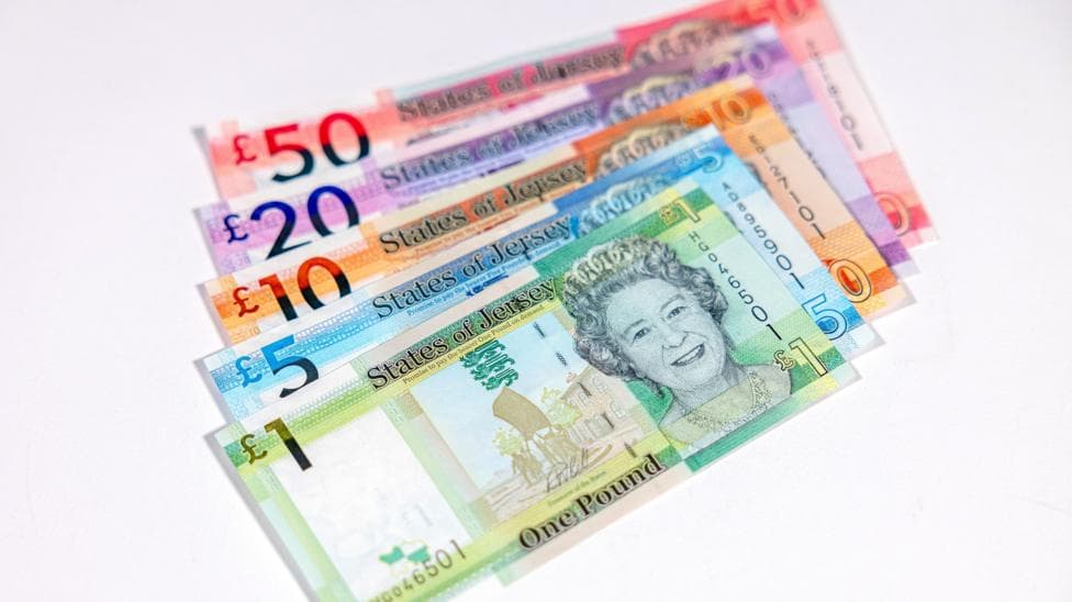 A stack of Jersey currency showing a notes including £1, £5, £10, £20 and £50.