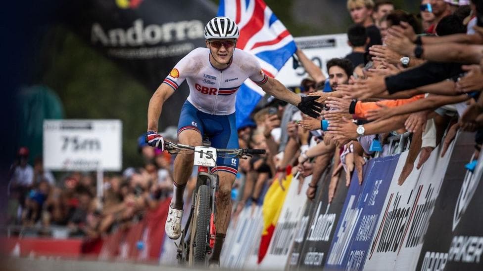 Charlie Aldridge "high fives" the crowd while competing for GB