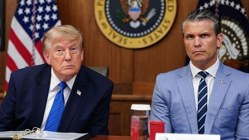 US President Donald Trump and Secretary of Defense Pete Hegseth listen to questions from the press during a Cabinet meeting.