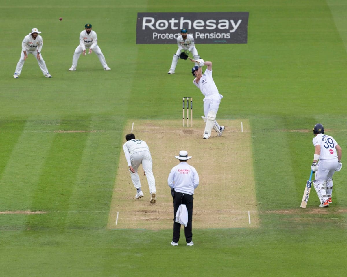 Dan Lawrence hits the ball high into the air while batting for England at Lord's