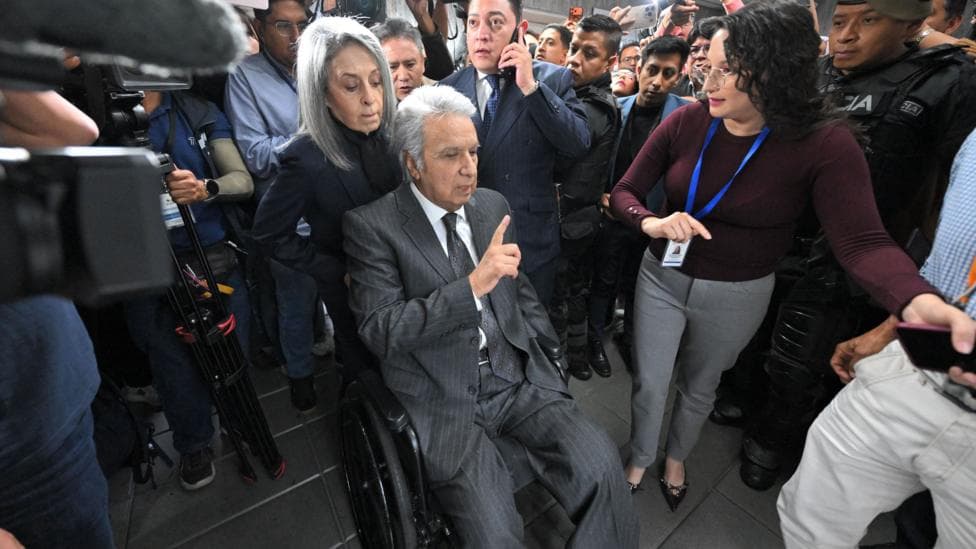 Lenin Moreno leaves the National Court of Justice during a corruption case in Quito.