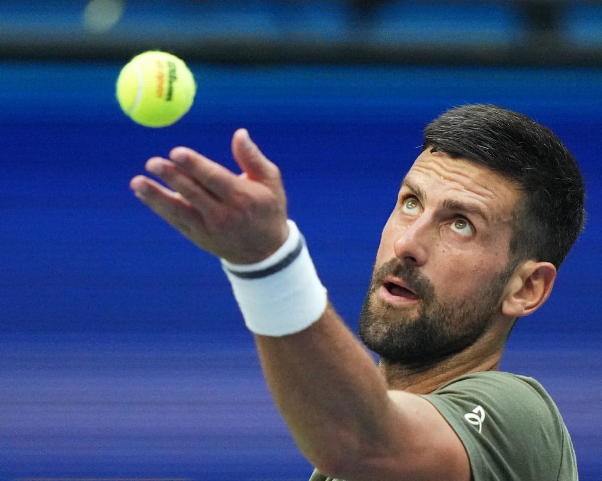 Novak Djokovic serves to Alexander Zverev during a practice at the US Open tennis championships in New York
