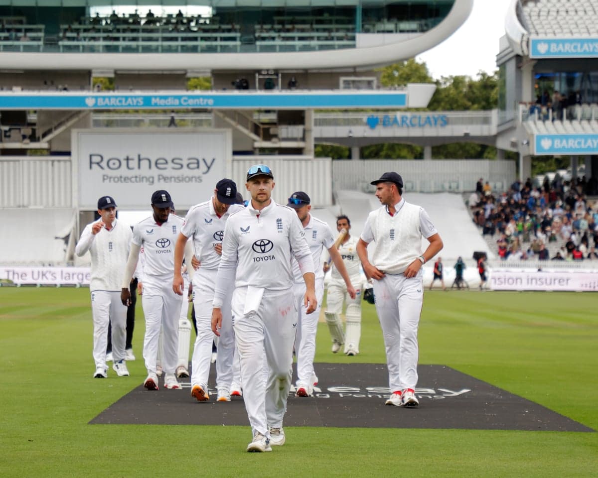 Joe Root leads his England players off after victory