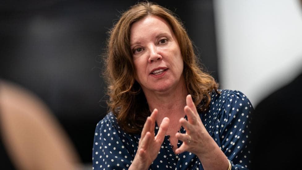 Dame Rachel de Souza, Children's Commissioner for England, wears a polka-dot blouse. She has auburn hair.