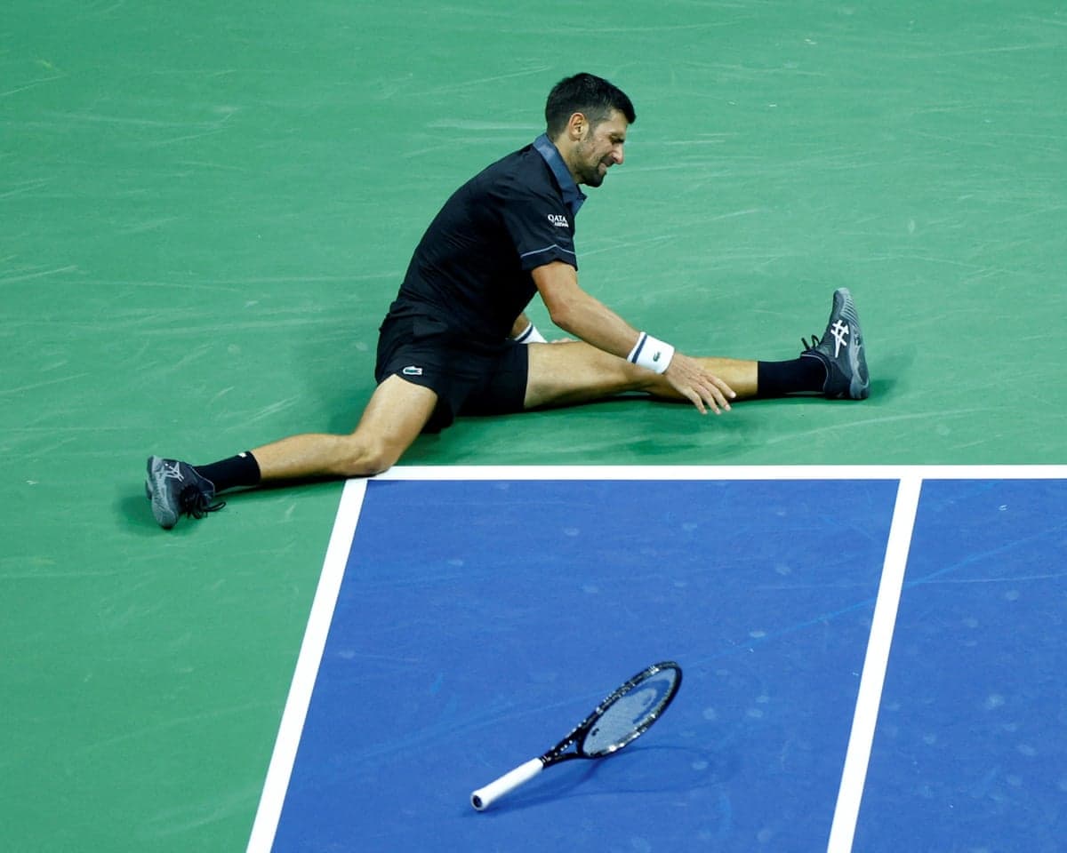 Serbia's Novak Djokovic slips on court