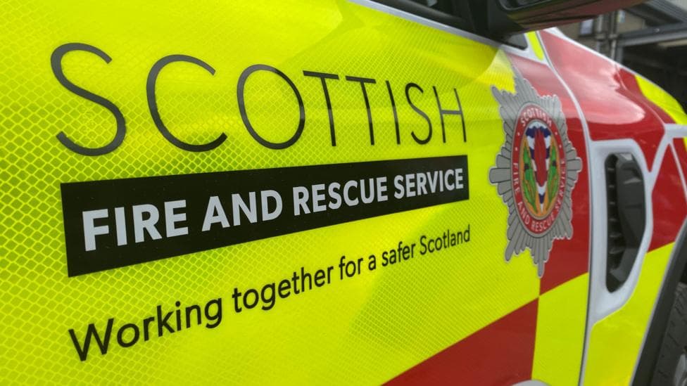 Close up of the side of a marked Scottish Fire and Rescue Service vehicle