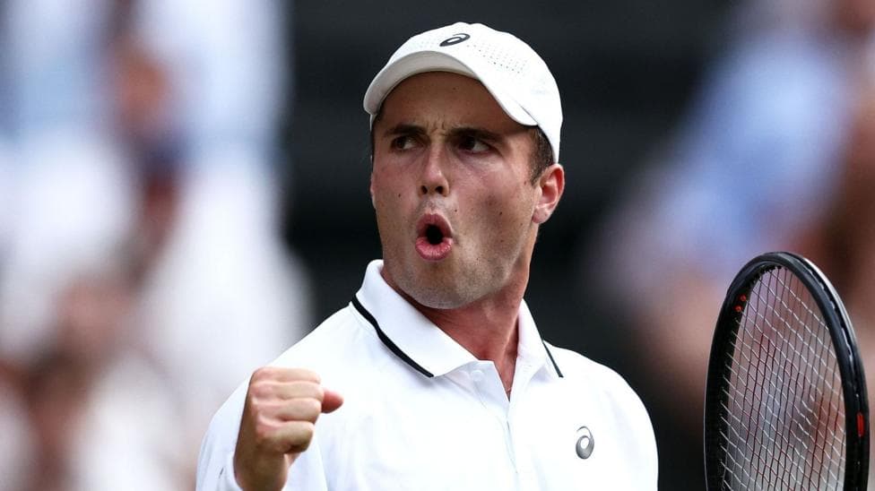 Arthur Fery reacts to winning a point at Wimbledon