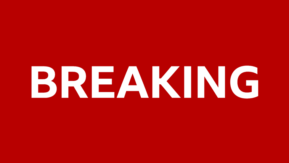 A red banner image with the word 'breaking' in white capital letters.