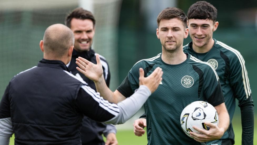 Celtic assistant manager Shaun Maloney greets Kieran Tierney in training