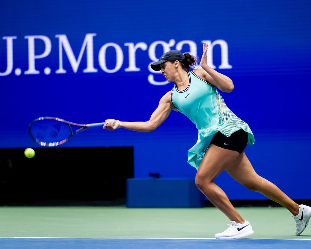 Madison Keys stretches to hit the ball