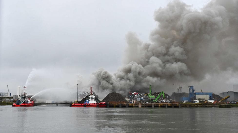 Two fire service boats attempting to extinguish the fire at the ship yard.