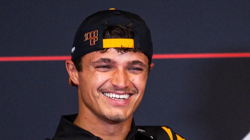 Lando Norris smiling during a Formula 1 news conference