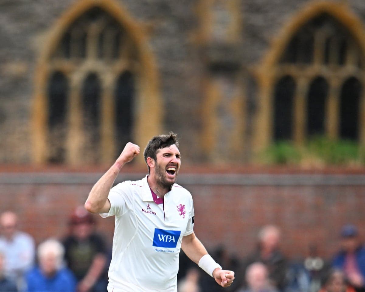 Craig Overton of Somerset celebrates the wicket of Mason Crane of Glamorgan at Taunton