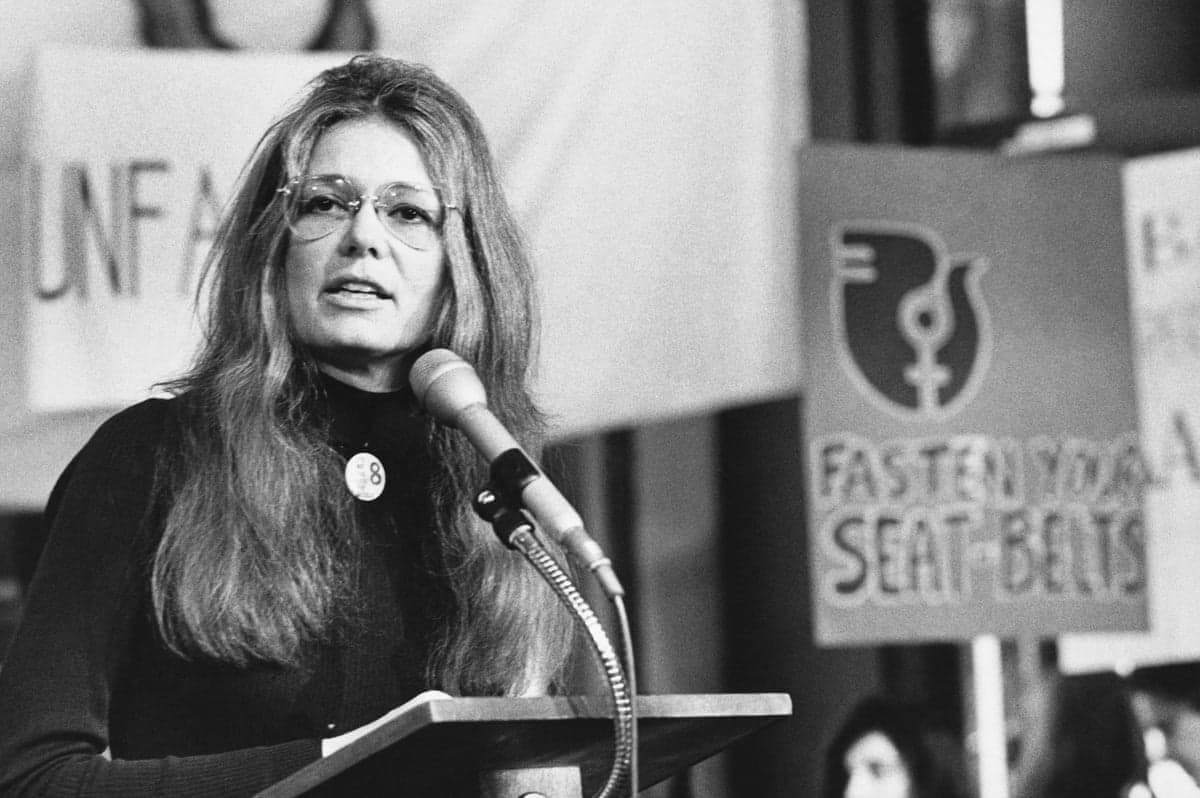 a woman speaks into a microphone