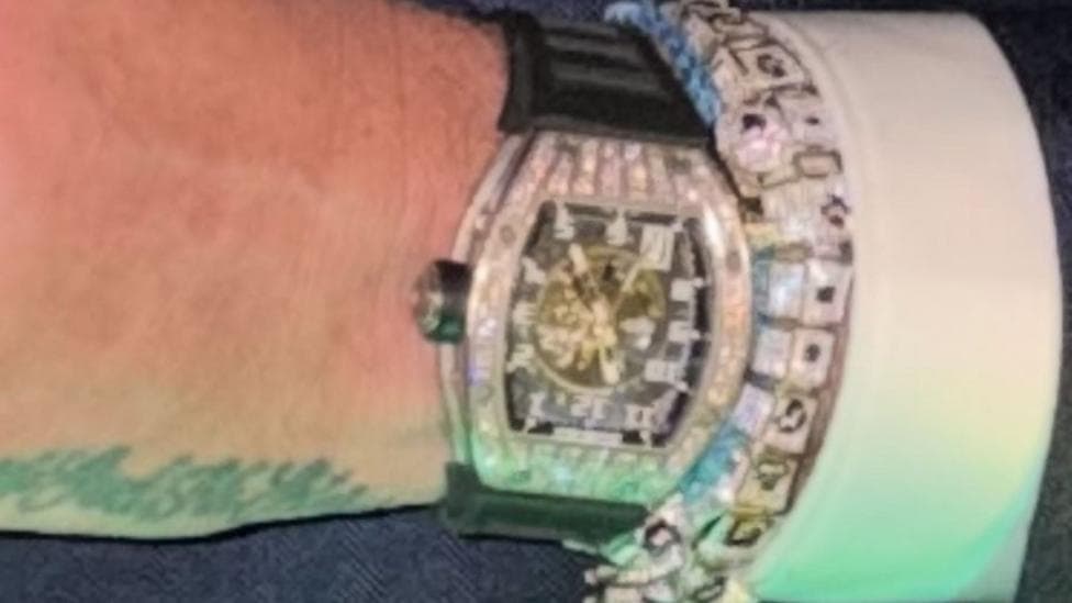 A close up picture of a diamond encrusted watch