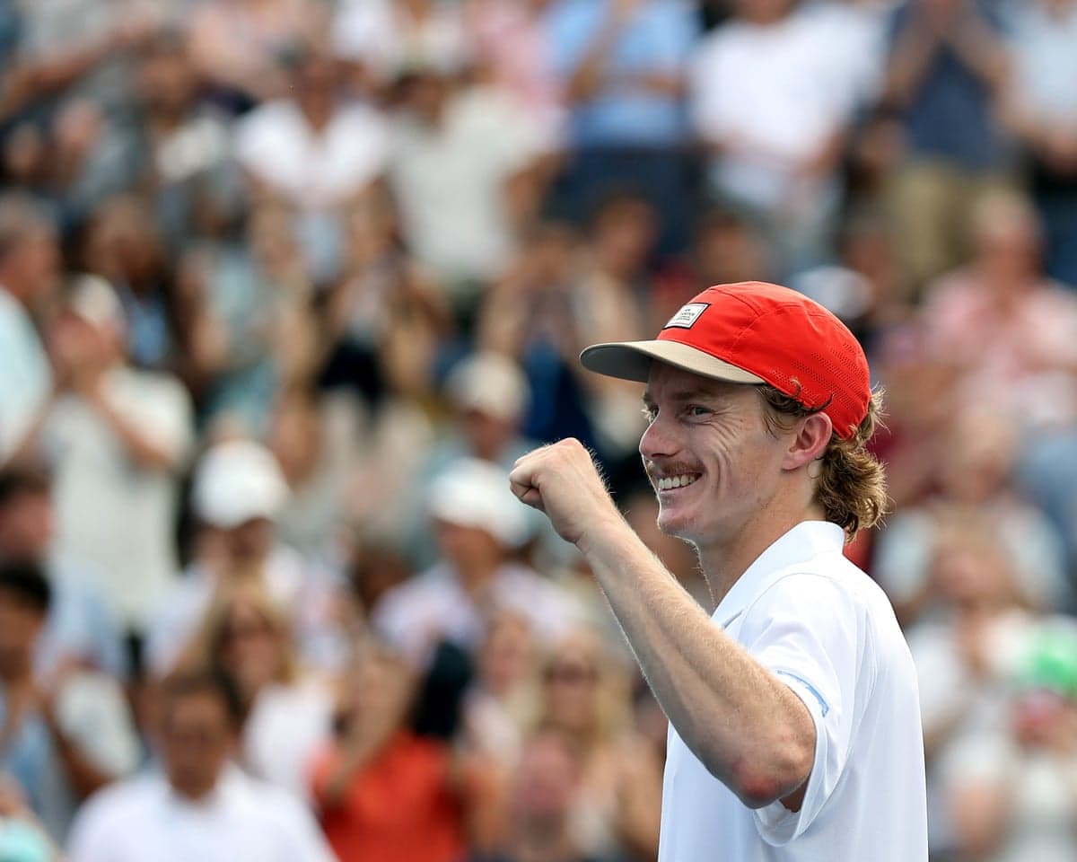 Dane Sweeny of Australia reacts after defeating Lorenzo Musetti of Italy