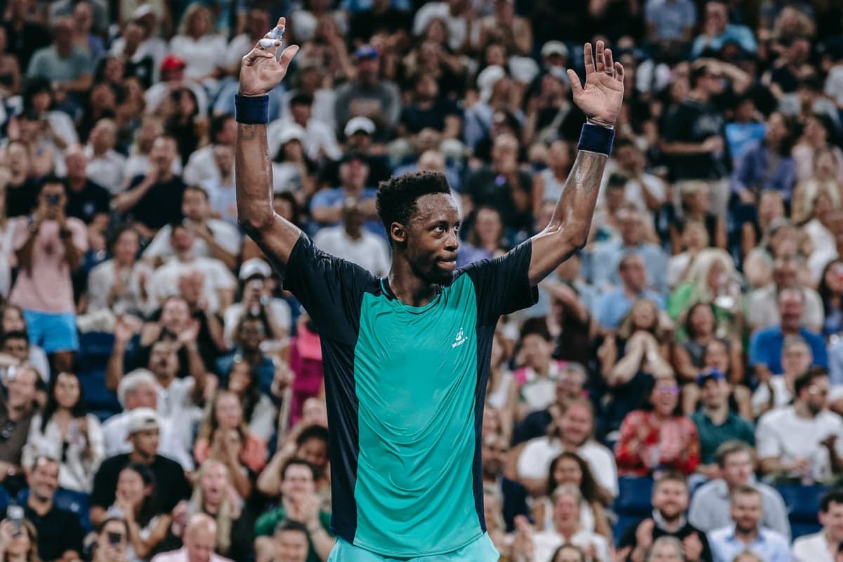 Fans salute Gael Monfils after his straight-sets defeat by Learner Tien in the second round of the US Open.