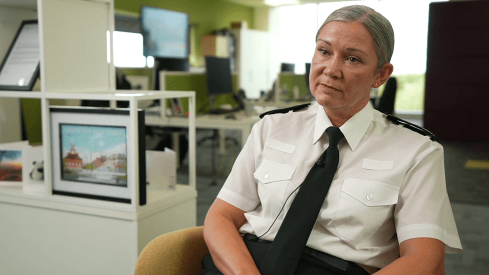 Chief Constable Victoria Fuller sits in a chair in an office wearing a police uniform.