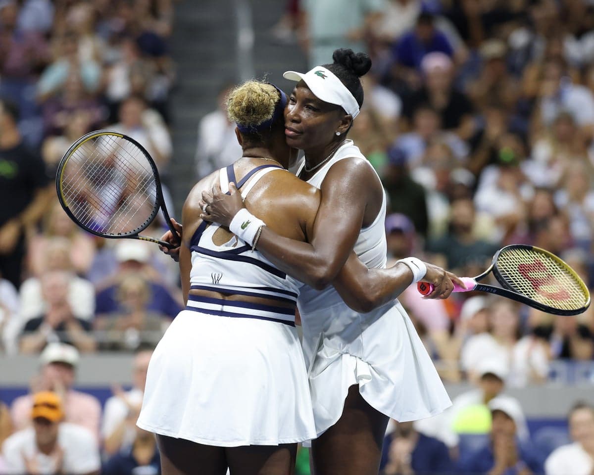 Williams sisters Serena and Venus embrace after defeat to Maya Joint and Hao-Ching Chan in a women’s doubles first round match at the US Open