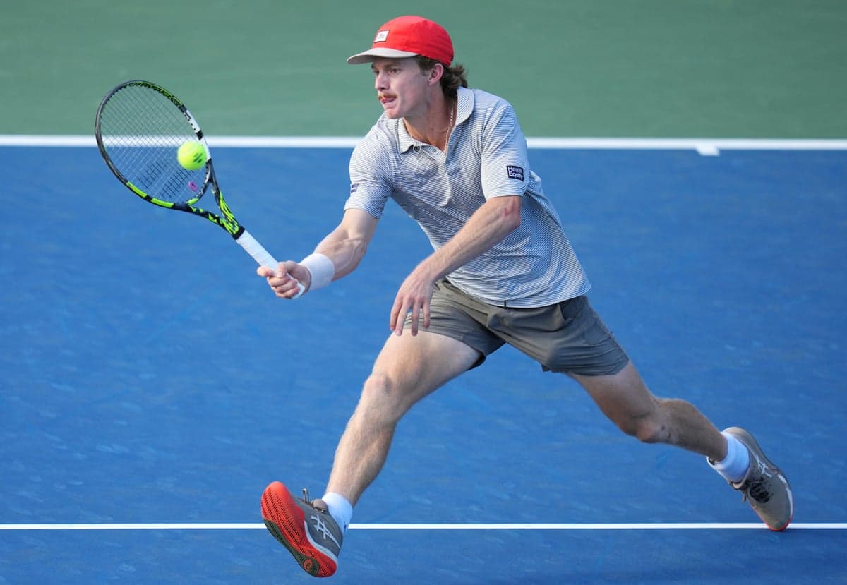 Dane Sweeney plays a volley
