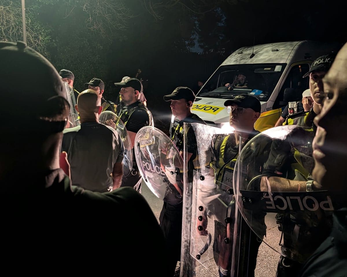 Police officers at the scene near Eastney Beach, Portsmouth, where hundreds of protesters gathered