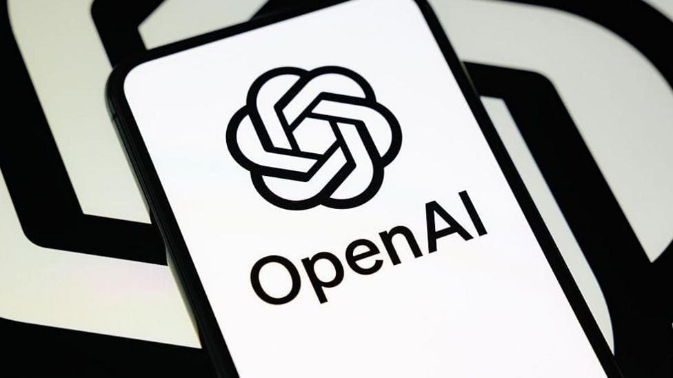 OpenAI's logo in black and white on a phone against a black and white spiral backdrop like its logo