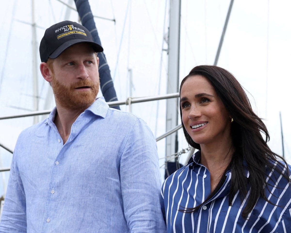 Harry and Meghan disembark after sailing on Sydney Harbour in Australia in April