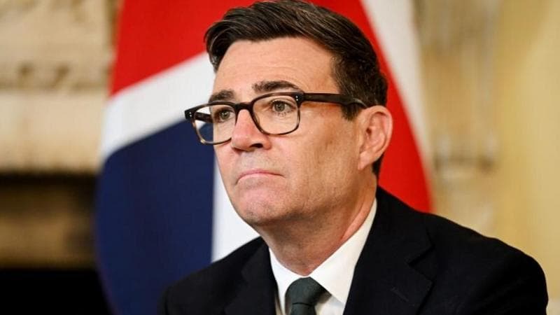 Andy Burnham sitting in front of a Union Flag in Downing Street