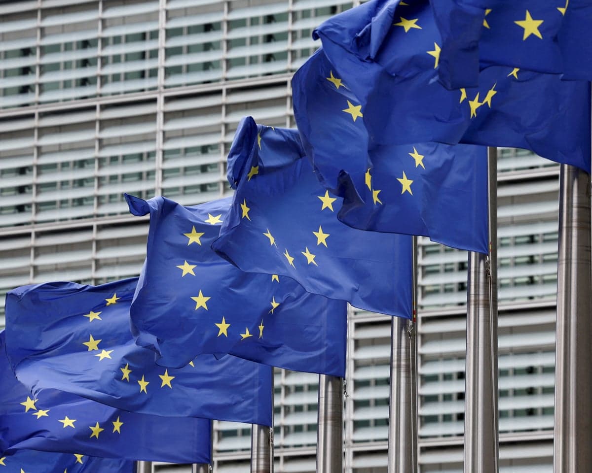 European Union flags outside the European Commission headquarters in Brussels.