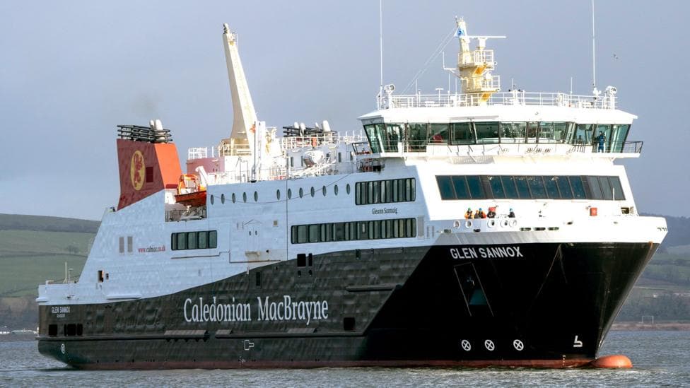 a large black and white ship with red funnels