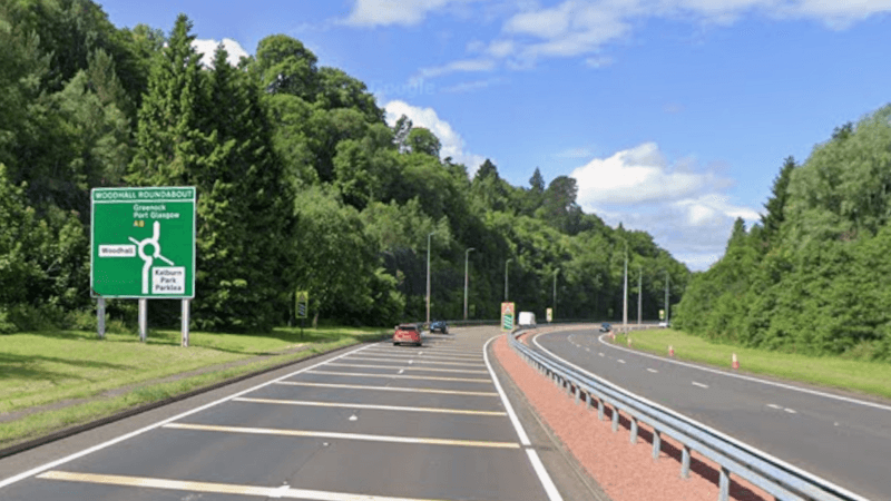 A screengrab from google maps showing two side of a dual carriageway surrounded by green trees.