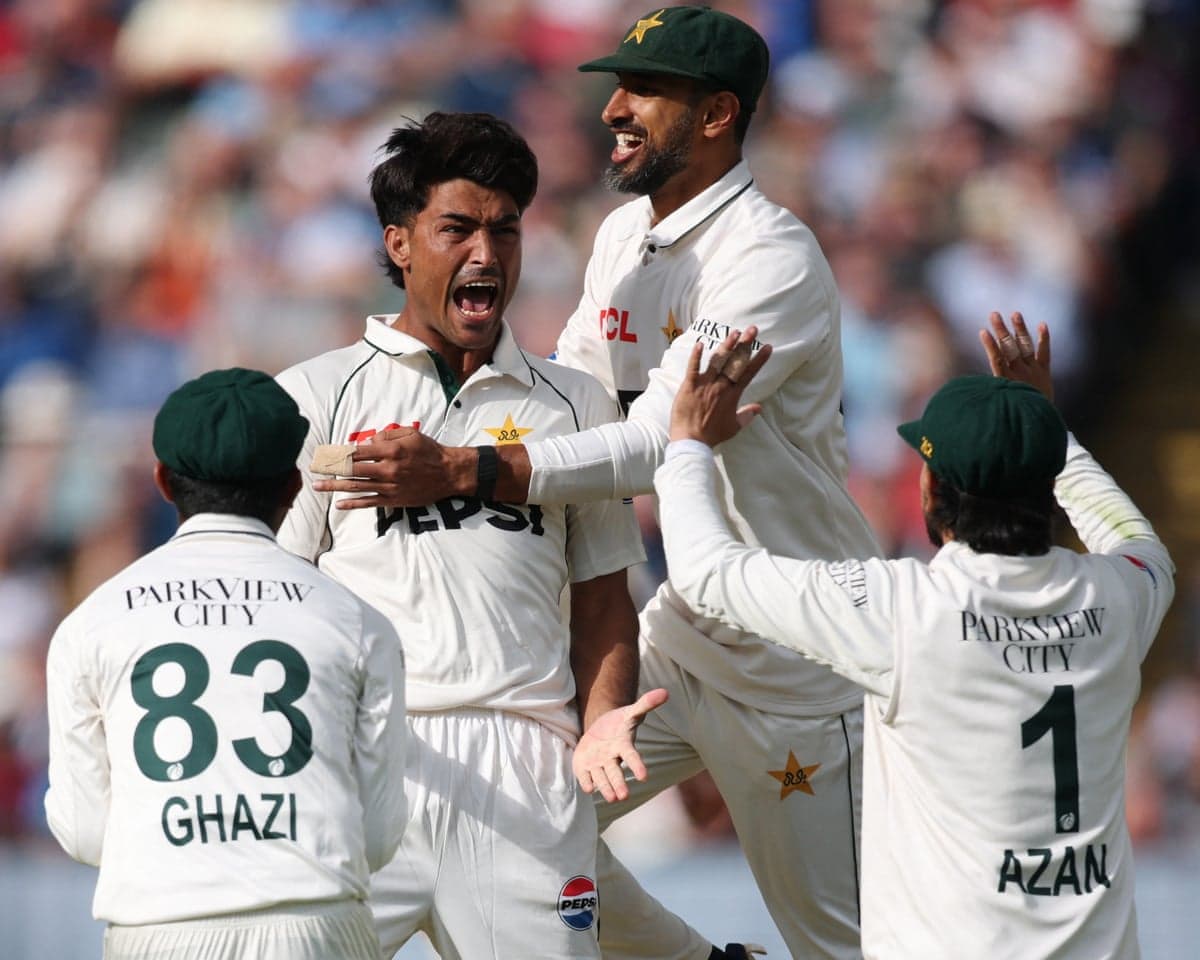 The Pakistan fast bowler Razaullah, along with his teammates Ghazi Gori, Shan Masood and Azan Awais, celebrates dismissing the England captain Joe Root on the first day of the third Test at Edgbaston.