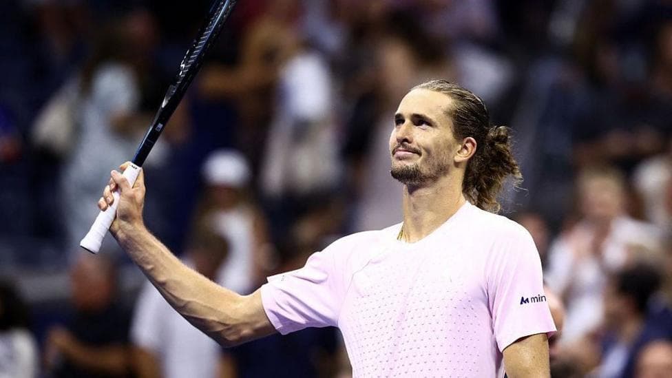 Alexander Zverev raises his racquet to the crowd