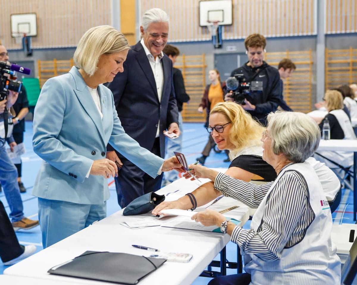 Social Democrats leader Magdalena Andersson and her husband Richard Friberg vote at a polling station in Nacka, Sweden on Sunday.