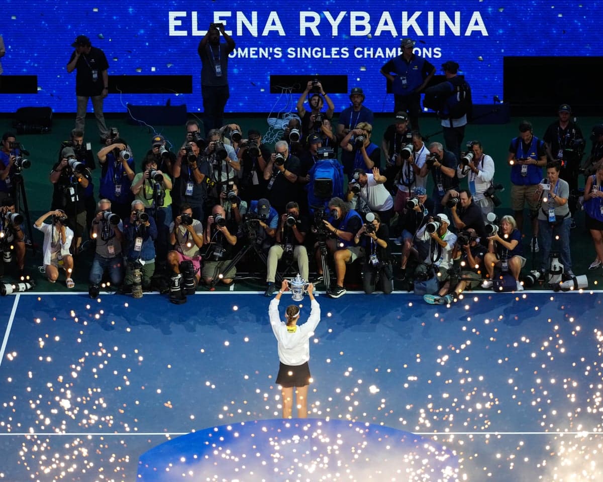 Elena Rybakina poses for pictures with the US Open trophy.