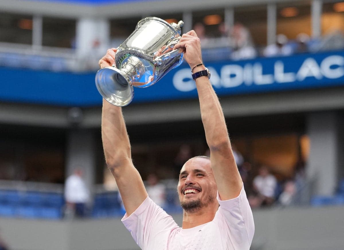 Alexander Zverev celebrates with the US Open trophy