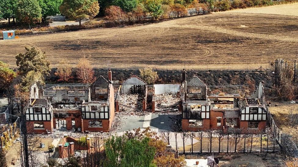 An aerial view of destroyed homes after the Stourbridge wildfire on August 21,