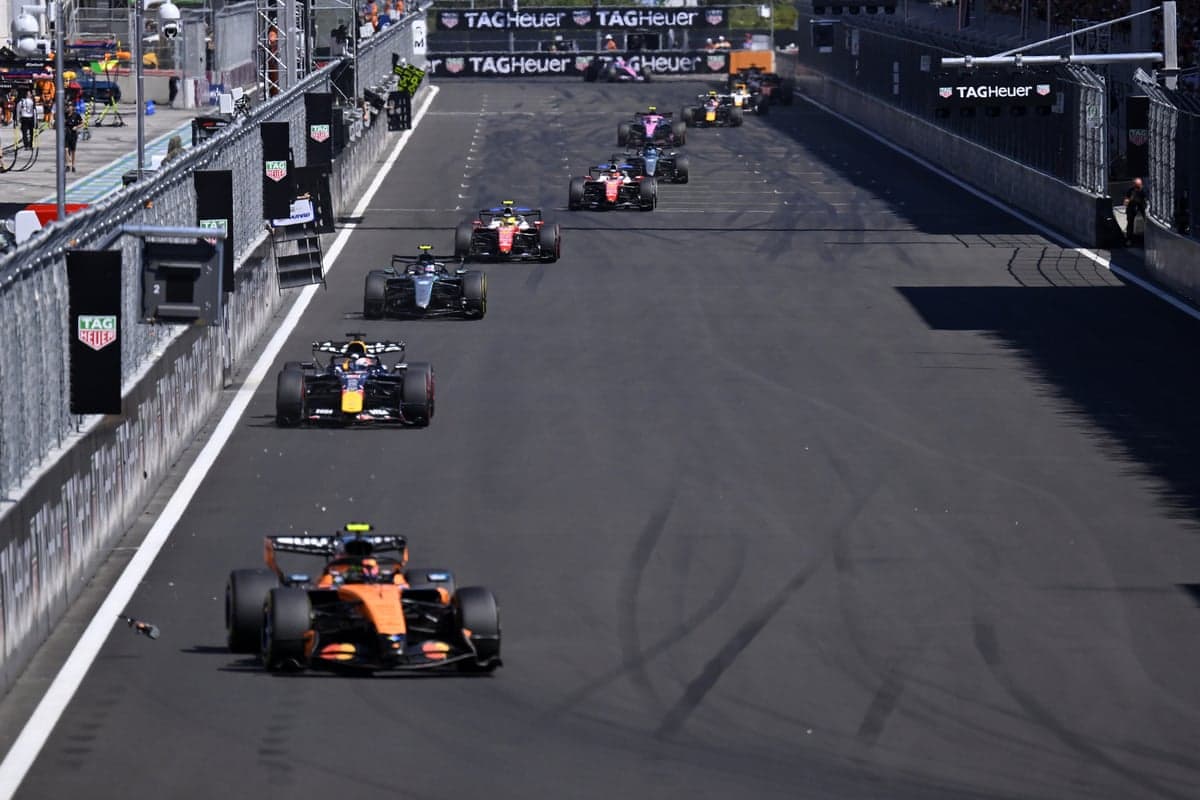 Formula 1 cars race in a line during the Spanish Grand Prix in Madrid
