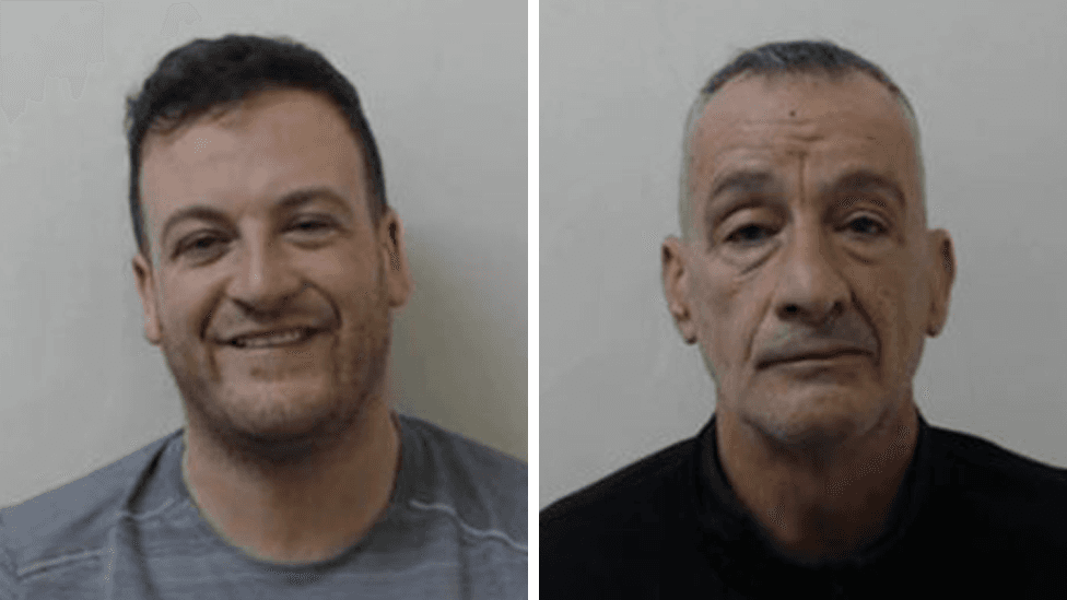 Police mug shots of two men - Douglas Mills Jnr and his father Douglas Mills. Mills Jnr is wearing a grey shirt and is laughing. Mills is wearing a black top and gas a more serious expression on his face.