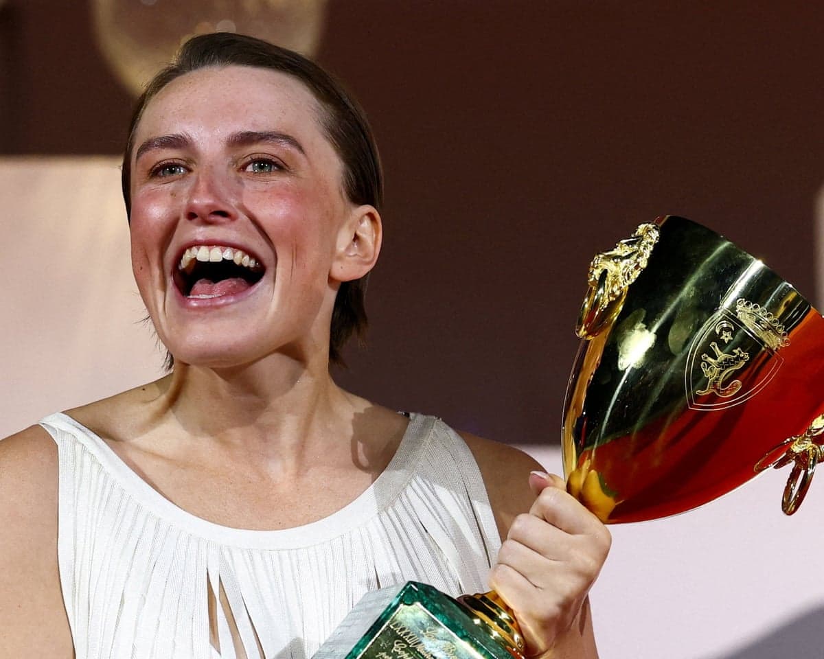 Mathilde Arcel poses with the Volpi Cup at the awards ceremony on Saturday in Venice.